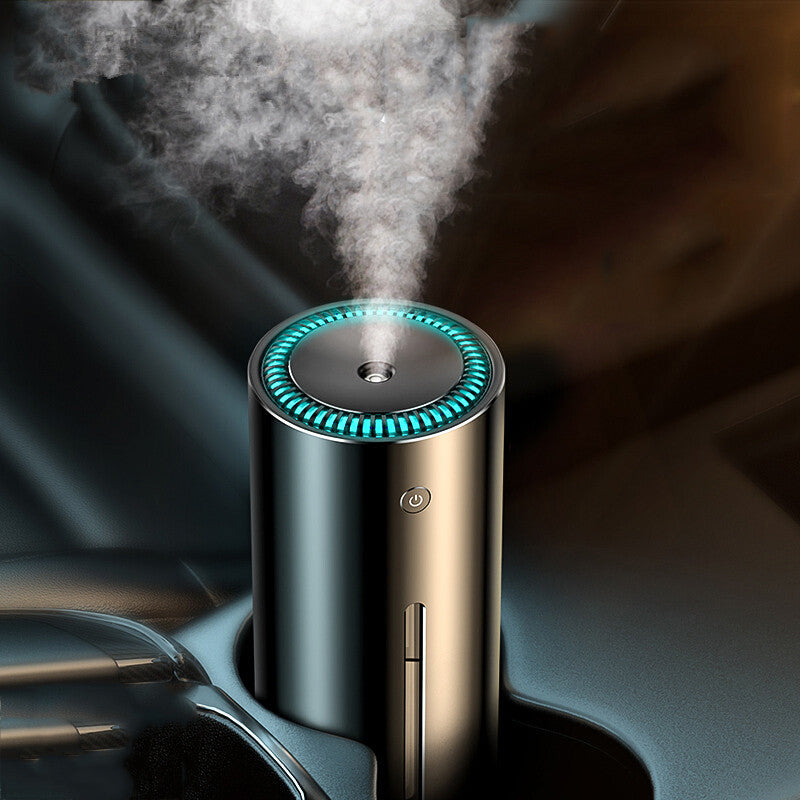 Car humidifier with steam emerging from it, placed in a car cup holder.