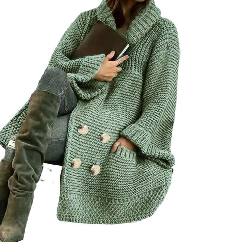 Green knitted coat worn by a person on a white background