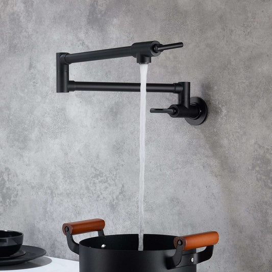 Elegant matte black pot filler faucet mounted on a marble kitchen backsplash, extended over a stainless steel stove with a large pot