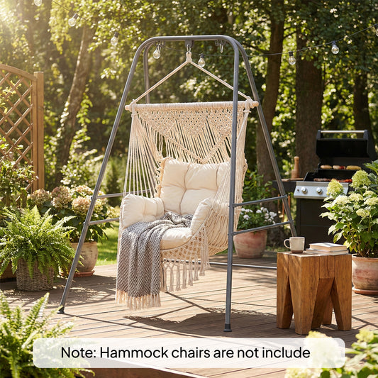 Gray metal hammock chair stand with anti-slip foot pads and carabiners in a backyard setting