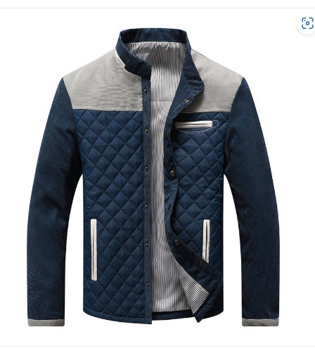 Blue quilted jacket with a white shirt underneath on a white background