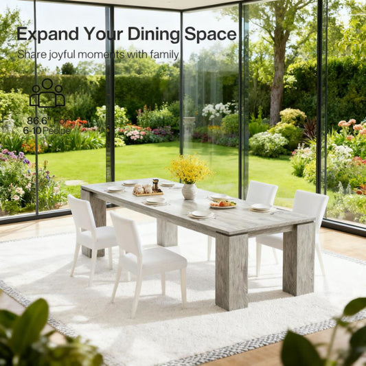Minimalist rectangular dining table in a bright, modern dining room with four contemporary chairs and a simple centerpiece