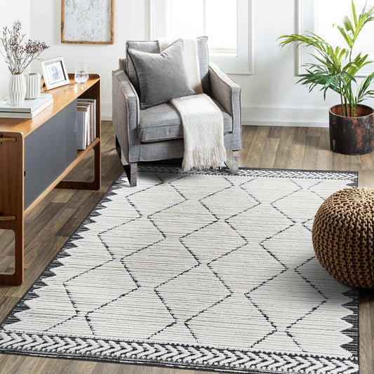 Modern 5x7 cream and anthracite indoor area rug featuring a high-low textured trellis geometric pattern in a contemporary living room.