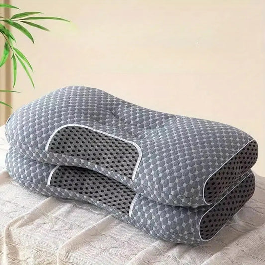 Two YBZ 3D knitted cotton massage pillows with a textured surface for neck support, displayed on a clean bed