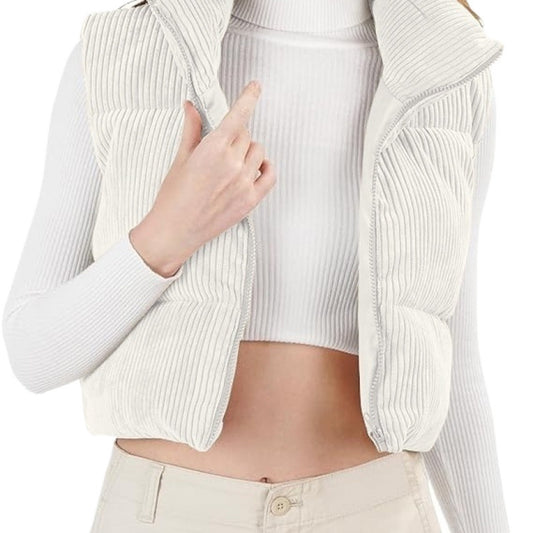 Person wearing a white ribbed knit cardigan over a white top on a white background