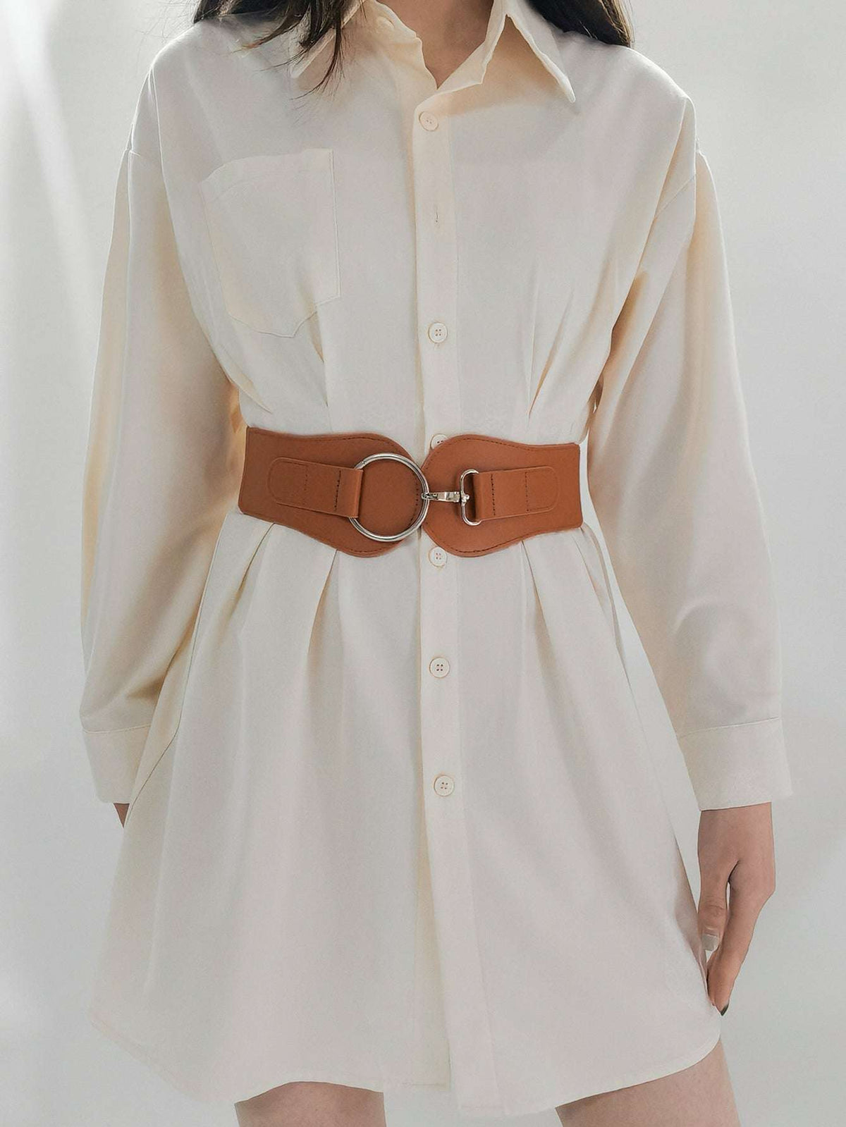 Caramel wide elastic belt with oval ring buckle centered on PU belt body