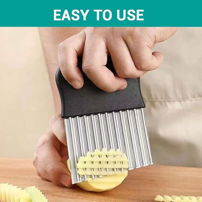 Black crinkle cutter slicer tool held above potato, ready to slice