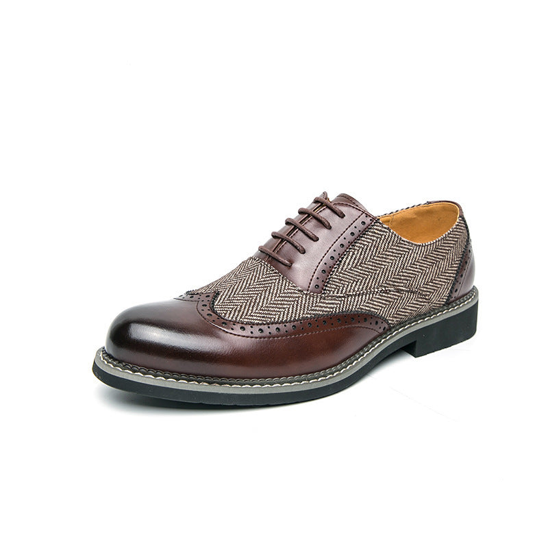 Brown leather shoe with patterned toe cap on a white background