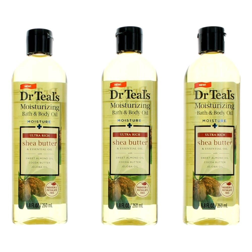 Bath and body oil trio bottles with black caps; shea butter and essential oil