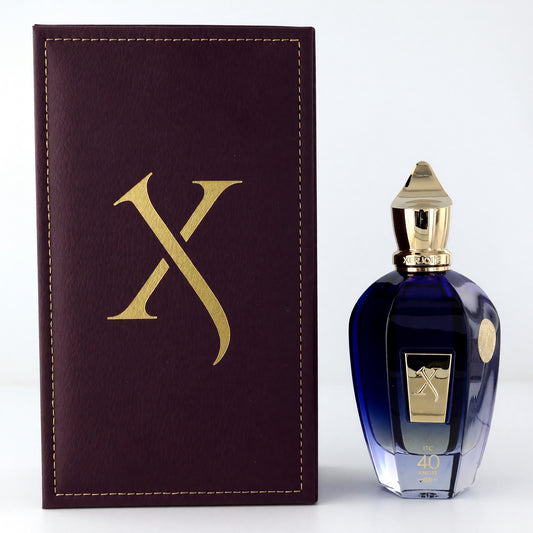 Unisex EDP spray bottle with blue glass and gold cap, shown beside maroon box