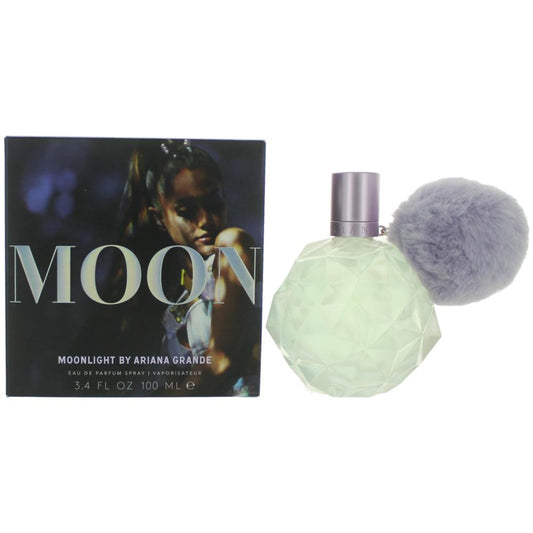 Perfume bottle with silver spray cap, mint green body, and matching gift box