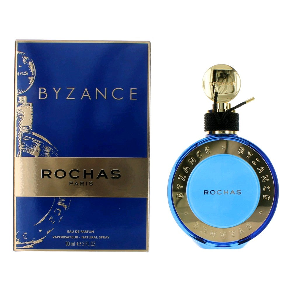 Blue EDP spray perfume bottle with gold cap and matching blue Rochas box