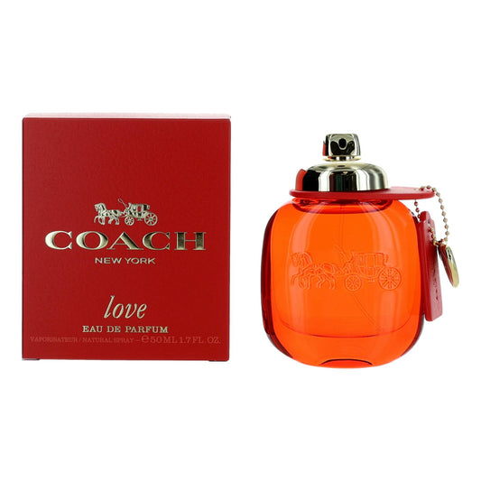 Women's perfume spray bottle with orange glass and silver cap, shown with red gift box.