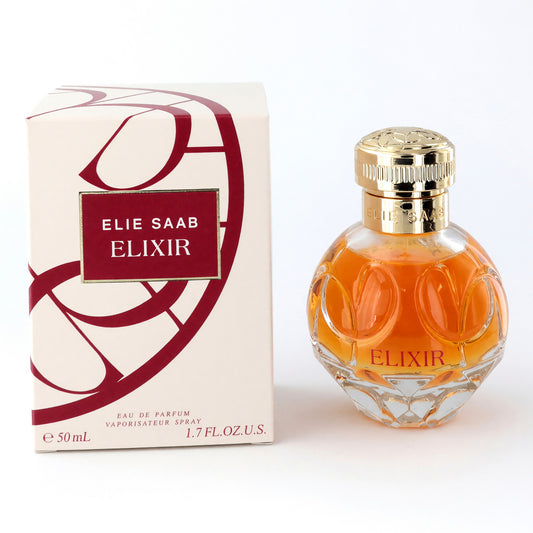 Women’s perfume EDP spray bottle with gold cap and amber liquid, with Elie Saab Elixir box.