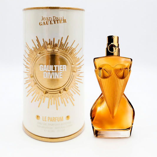 Amber perfume bottle with gold cap and matching cylindrical box for women