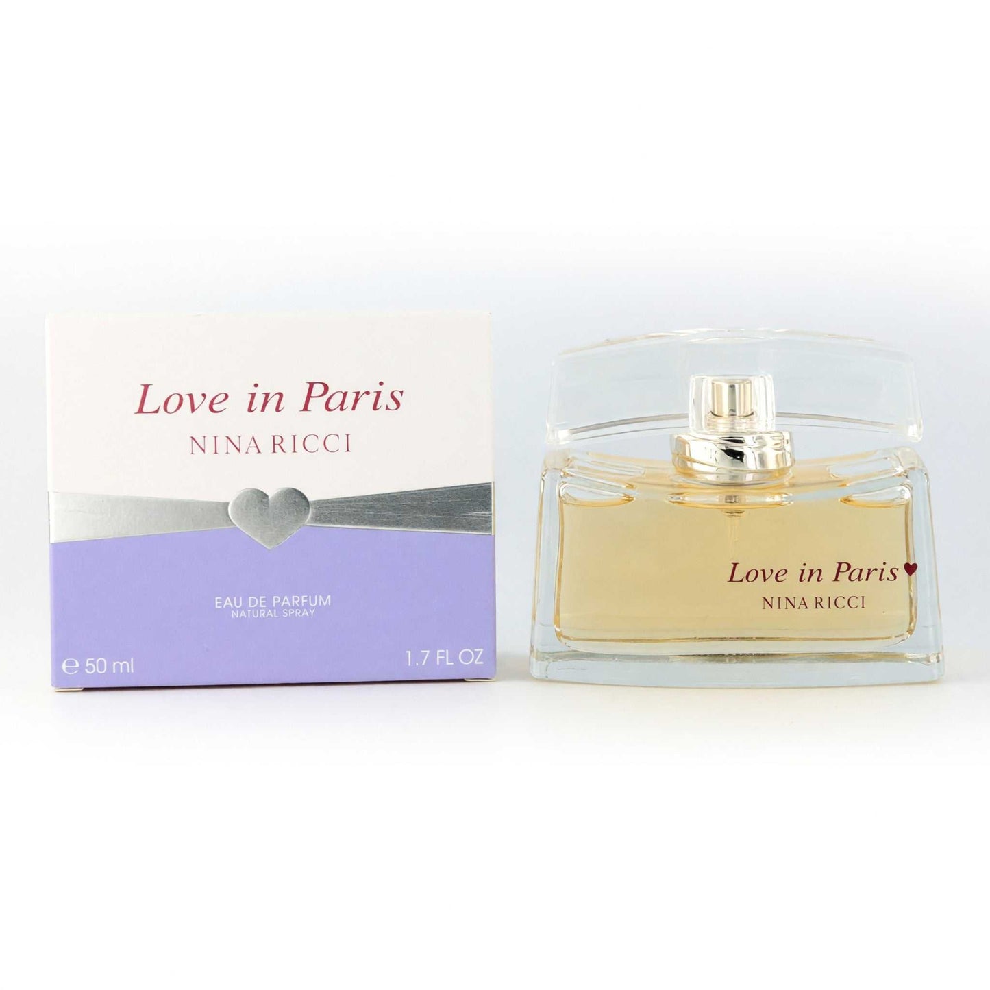Women's eau de parfum spray bottle with Love in Paris box and gold cap