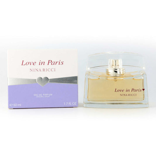Women's eau de parfum spray bottle with Love in Paris box and gold cap