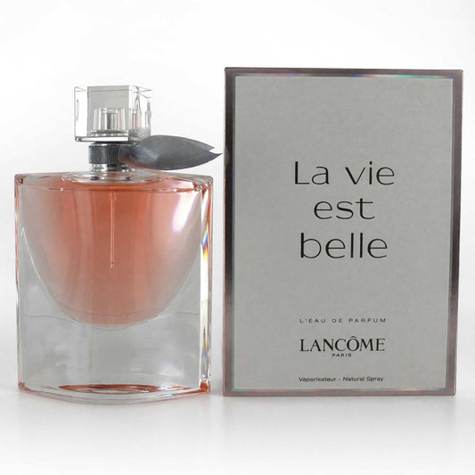 Women's Eau de Parfum spray in clear glass bottle with pink liquid and silver cap