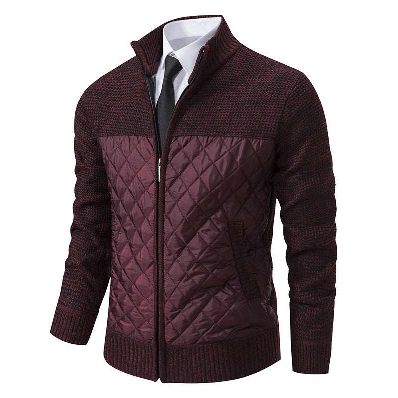 Maroon patterned sweater over a white shirt with a black tie on a white background