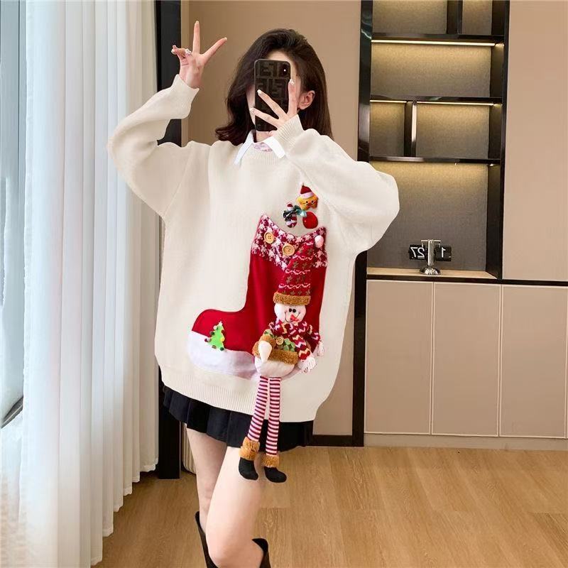 Person wearing a festive sweater with a red stocking design in a room.