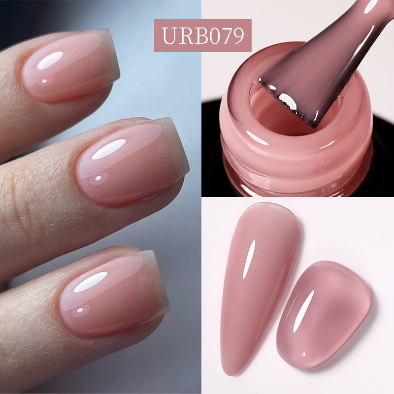 Glitter gel polish on almond nails, glossy sheer mauve-pink shade.