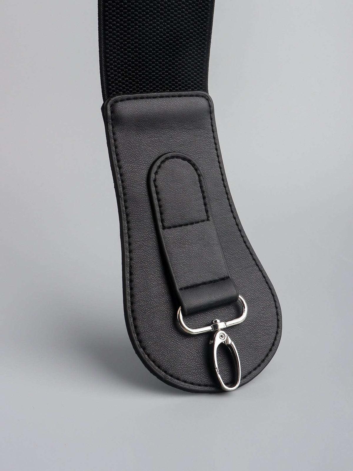 Black wide belt end with silver ring and small clasp, textured elastic backing