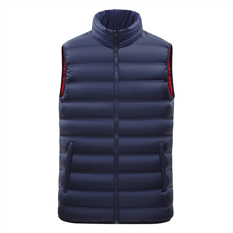 Blue puffer vest with red accents on a white background