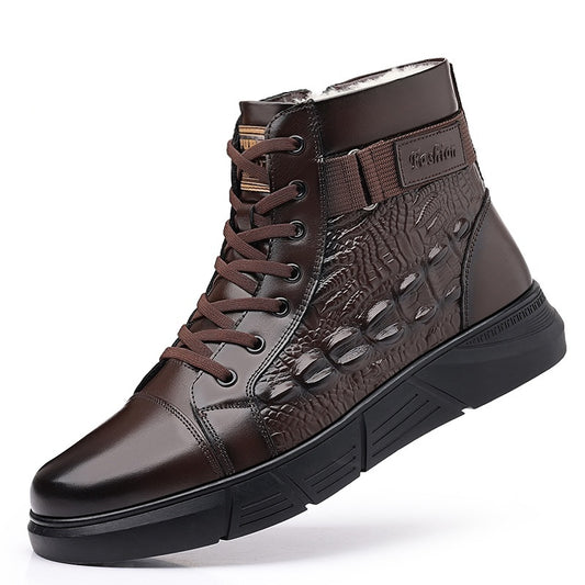 A pair of brown, lace-up snow boots with rubber soles and a round toe style. The boots appear to be made of genuine leather and have a printed design resembling animal scales.