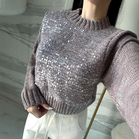Person wearing a sparkly brown sweater indoors