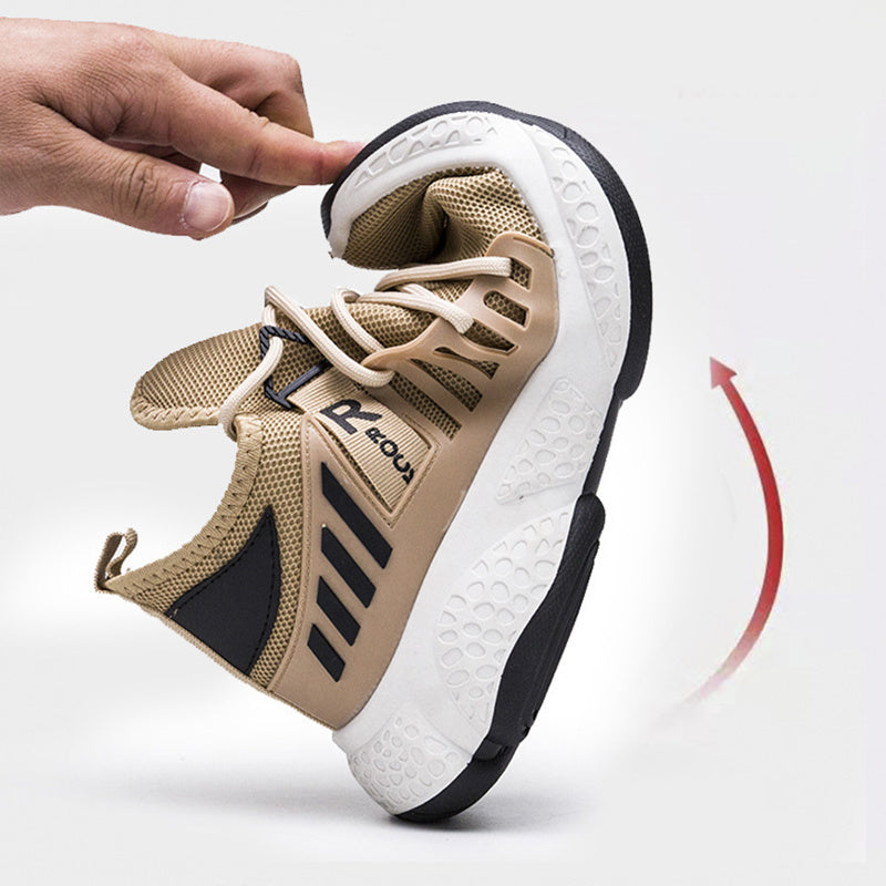 Beige and black sneaker with a hand pointing to it on a white background
