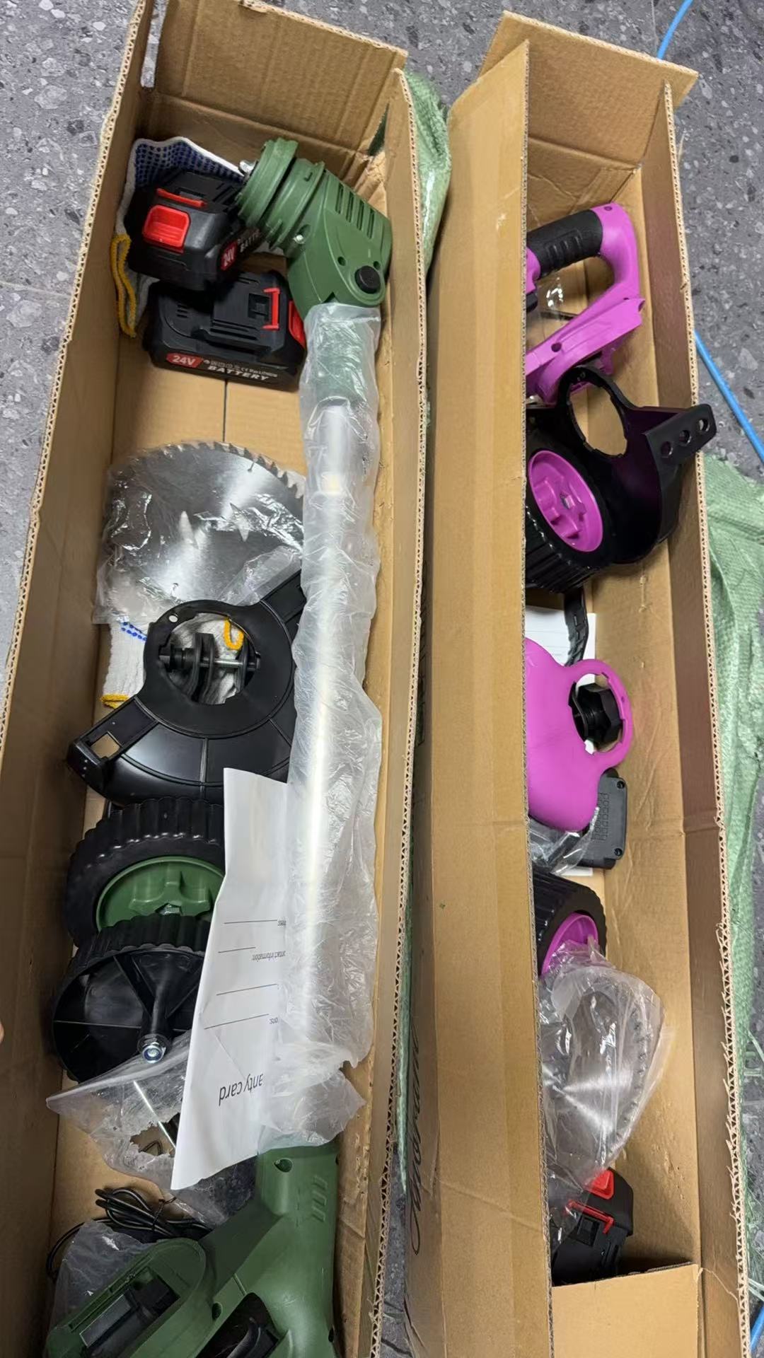 Cordless weed eater accessory set in carton with multiple trimmer heads and guards
