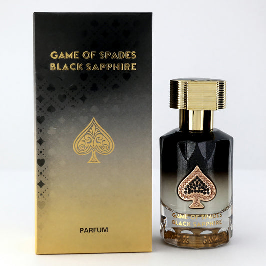 Unisex black parfum spray bottle with gold cap, shown with matching box