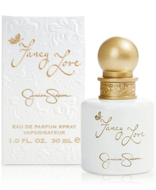 Women's eau de parfum spray bottle with gold cap, white bottle and gold script