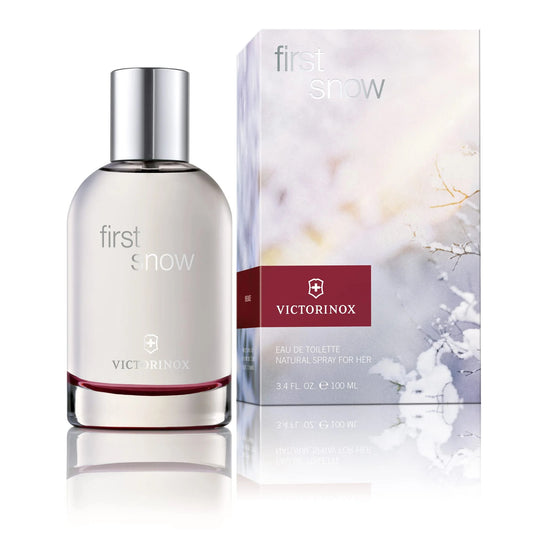 Women's eau de toilette spray bottle with silver cap and matching First Snow box