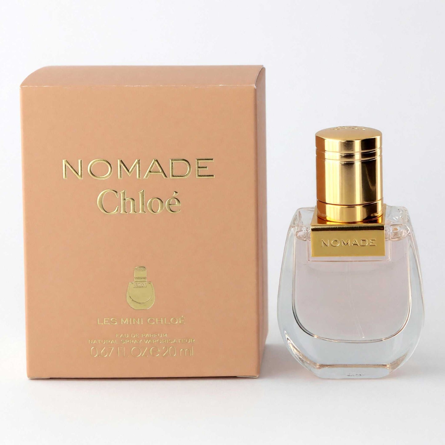 Nomade Les Mini perfume bottle and box, clear glass with gold cap, 0.67 oz EDP