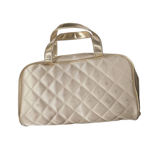 Quilted metallic cosmetic bag with diamond pattern, top handle and zip closure