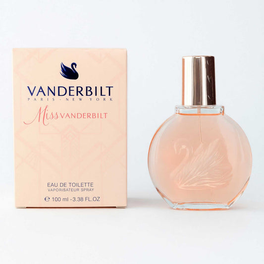 Women's eau de toilette spray bottle with pink glass and gold cap, with box
