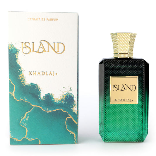 Extrait de parfum spray bottle with teal glass and gold cap, shown with matching box