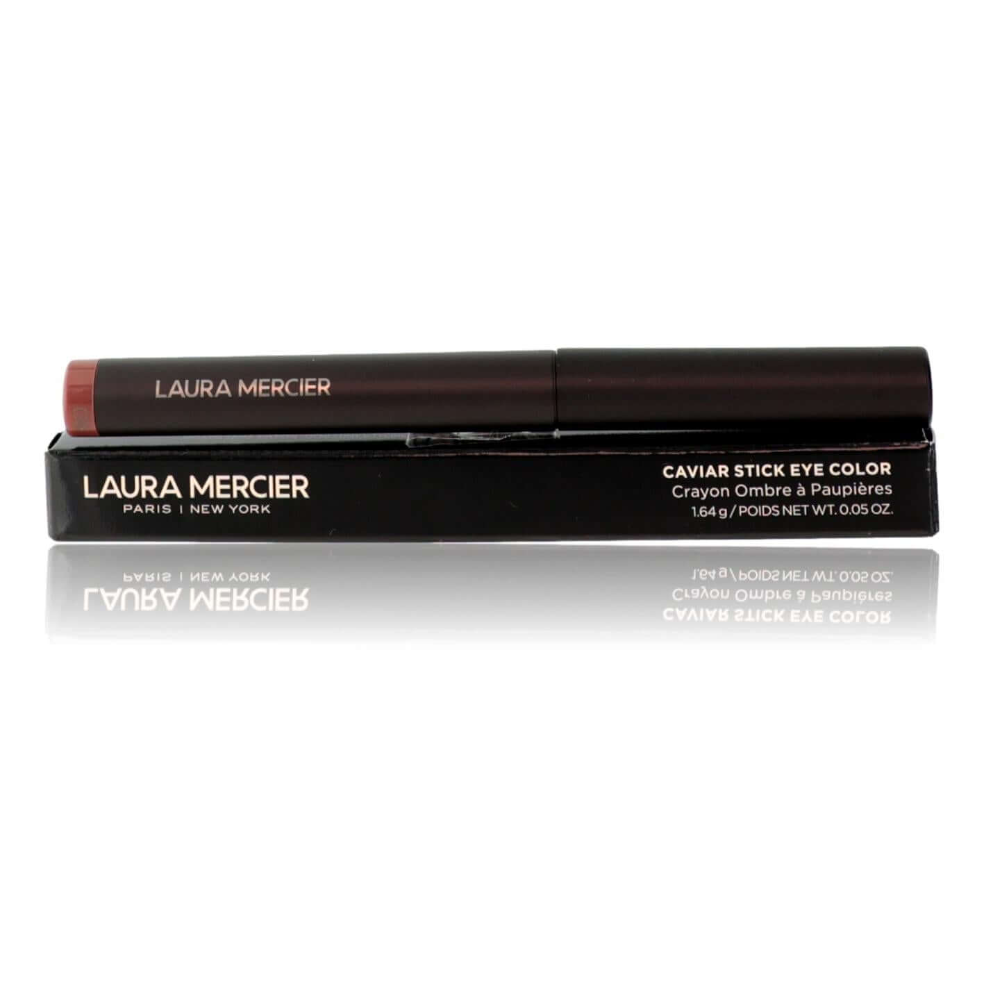 Eyeshadow stick in brick shade, twist-up cylinder with black cap.