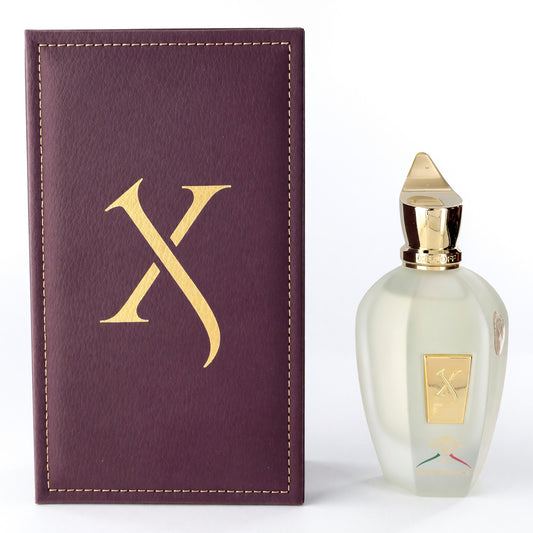 Eau de parfum spray bottle with gold cap and matching dark purple logo box