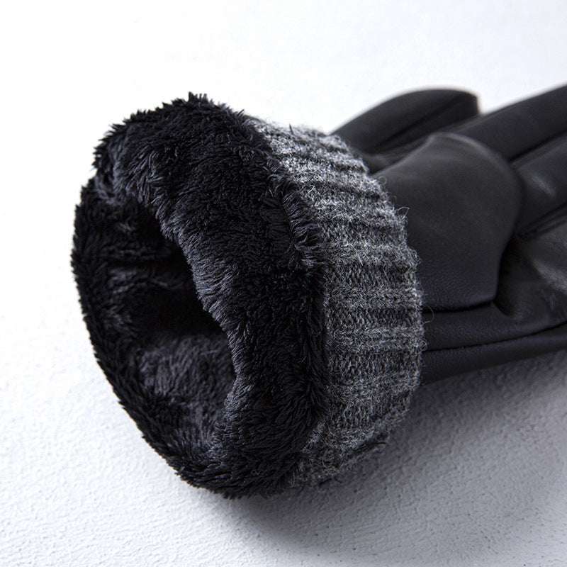 Black gloves with textured cuff on a white background