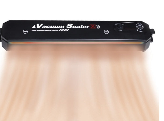Black vacuum sealer with control panel and orange sealing strip