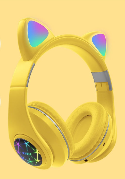 Yellow headphones with cat ear design on a yellow background