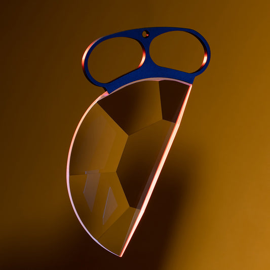 Decorative object with blue handle and geometric design on a brown background