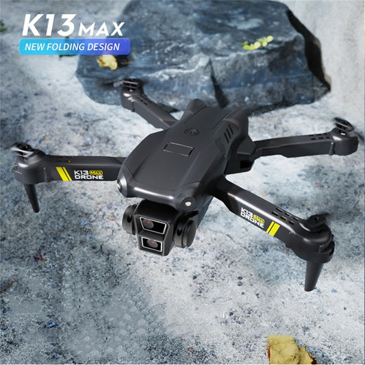 TheK13 Smart Camera Drone With 2 Batteries Features Real-time Image Transmission From A Single Camera. It Has One-click Touch And Landing Functions. This Is A Foldable Remote-controlled Drone Toy, Ma