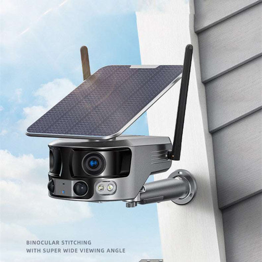 Outdoor security camera with solar panel on a house exterior
