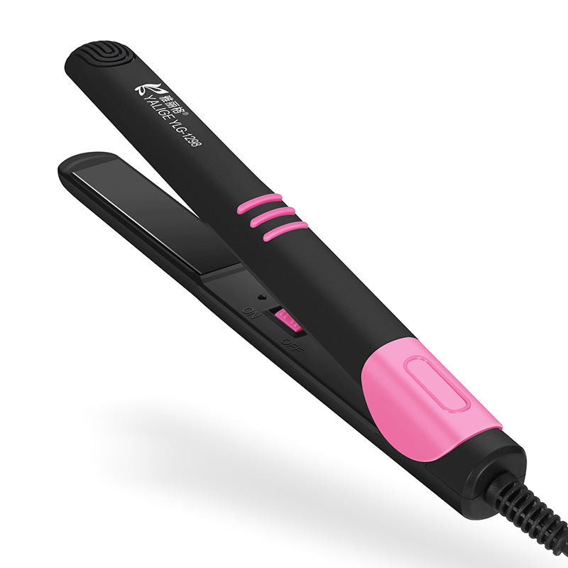 Black and pink hair straightener on a white background