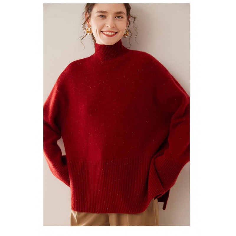 Person wearing a red sweater against a plain background