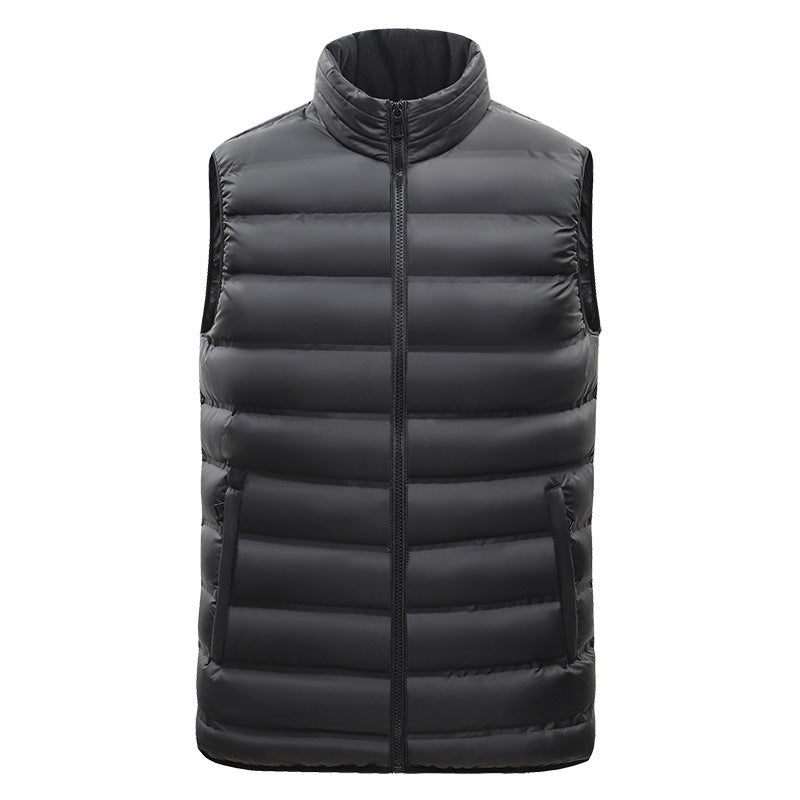 Black puffer vest on a white background