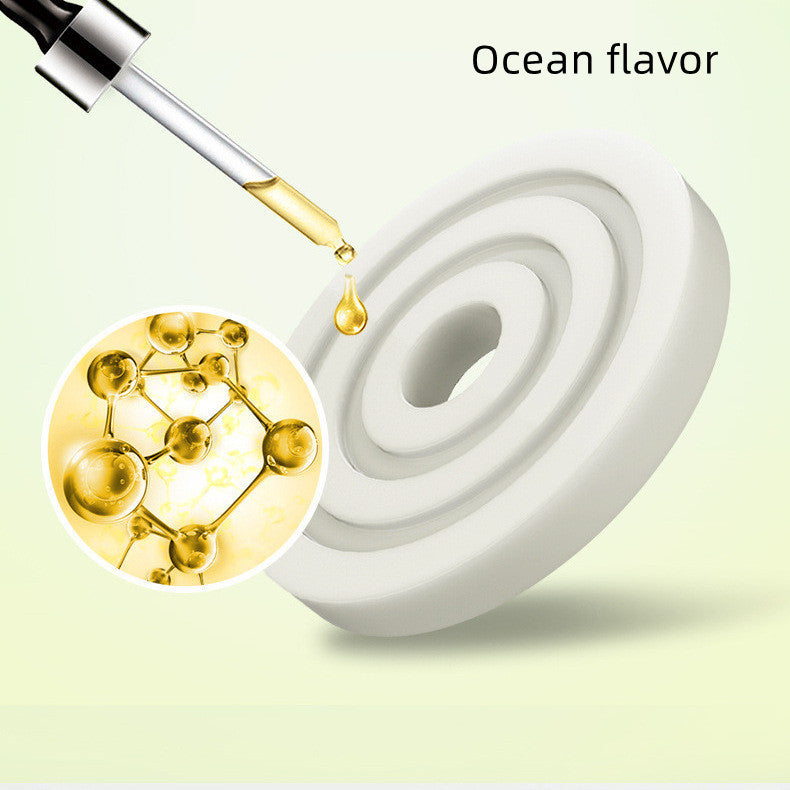 Dropper with liquid being added to a white container, labeled 'Ocean flavor', on a light green background.